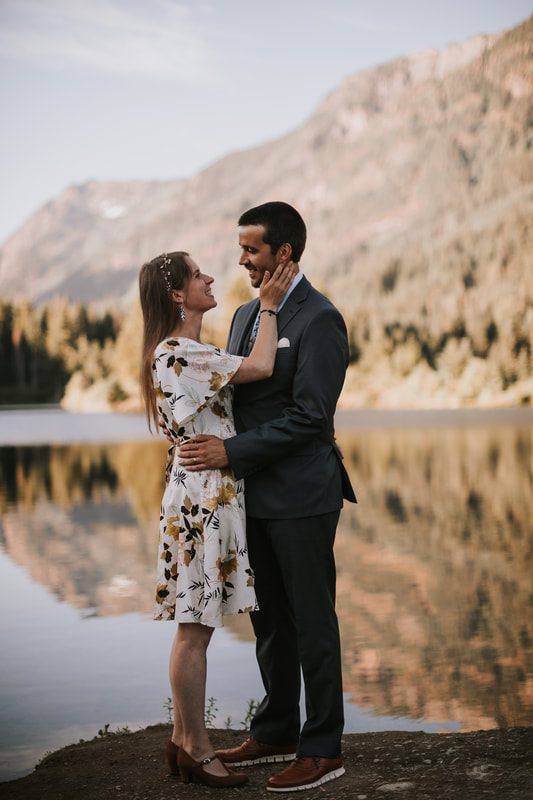 Couple embracing near a river in the Snoqualmie Valley