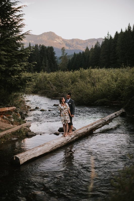 Candid moment of the couple embracing in the forest