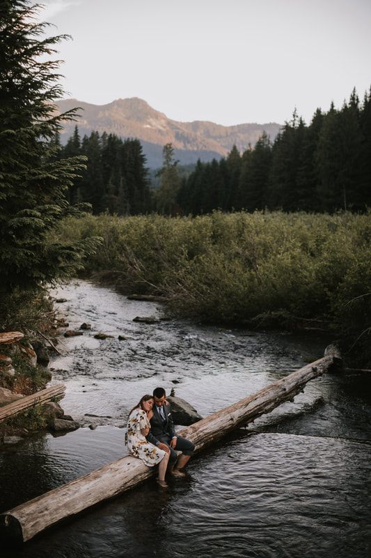 Wide landscape shot featuring the couple in the valley