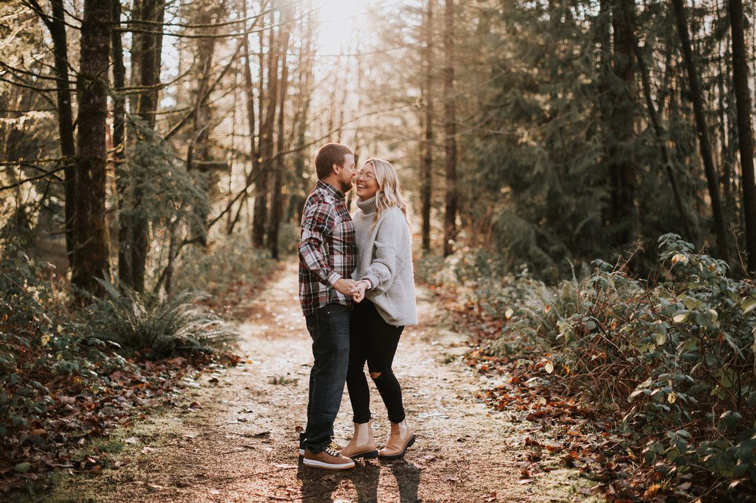 Jesse and Sara laughing together during their North Bend engagement session