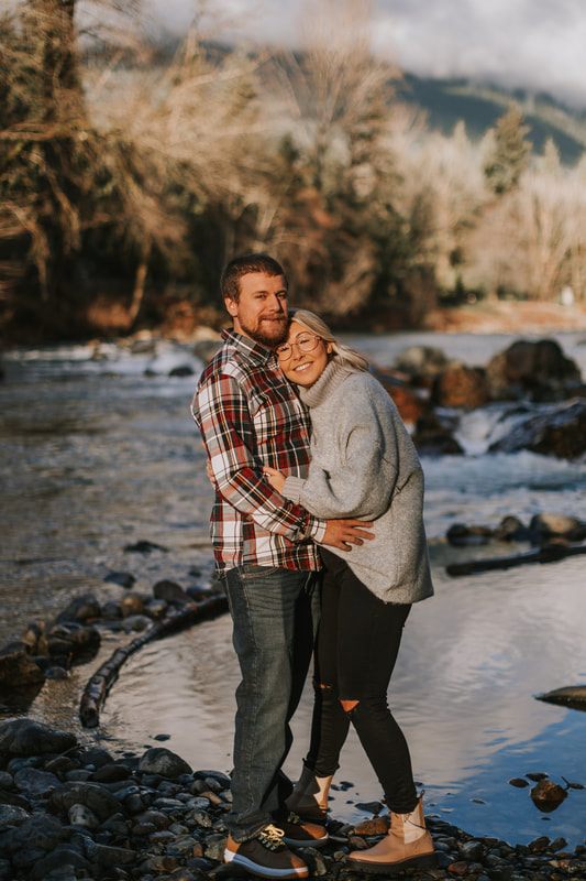 Sunset engagement portrait with the Cascade mountains in view