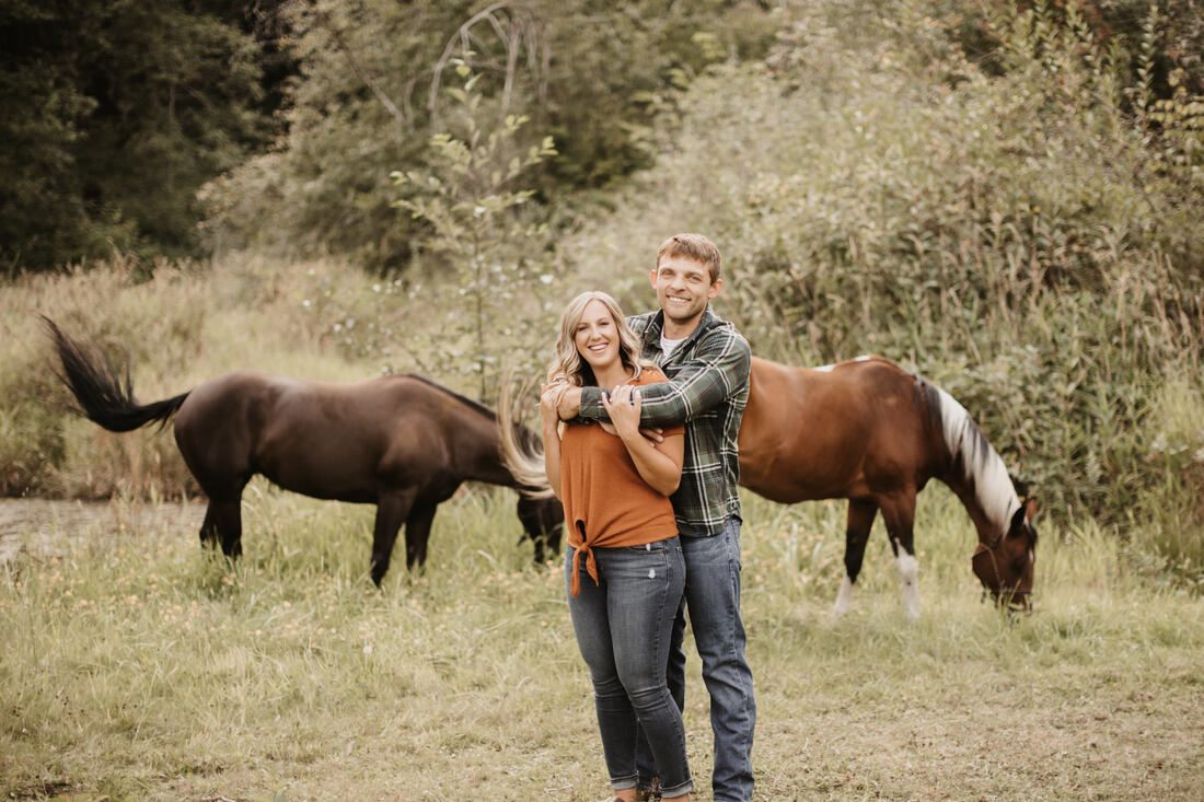 Couple petting a horse together on their Snohomish property