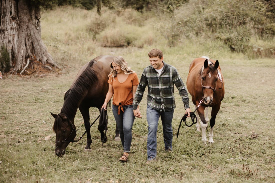 Couple embracing in an open field on their Washington farm