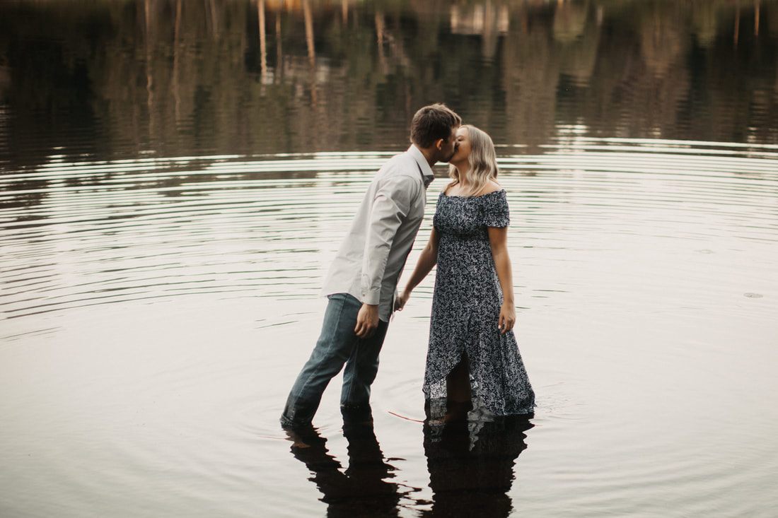 Couple laughing together in the late afternoon farm light