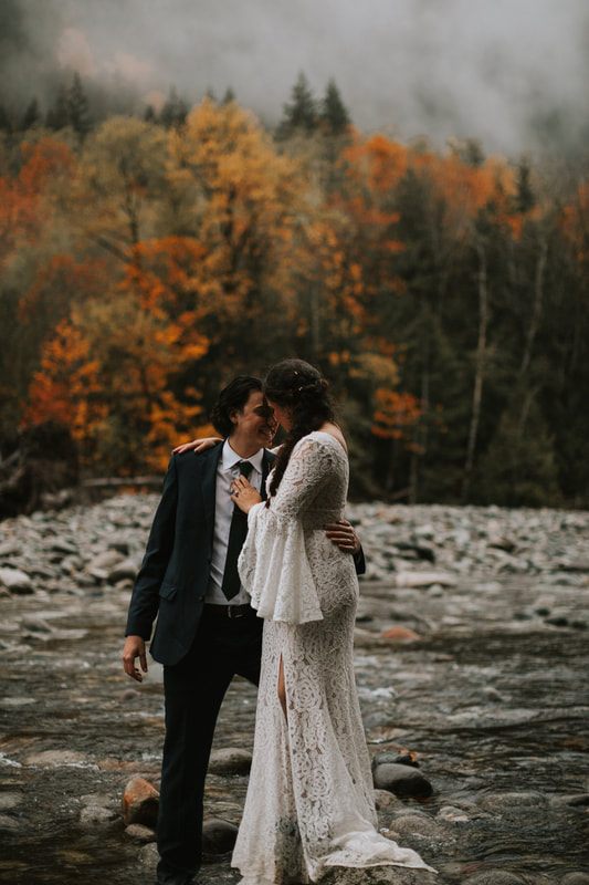 Bride and groom relaxing together inside the cozy A-frame cabin