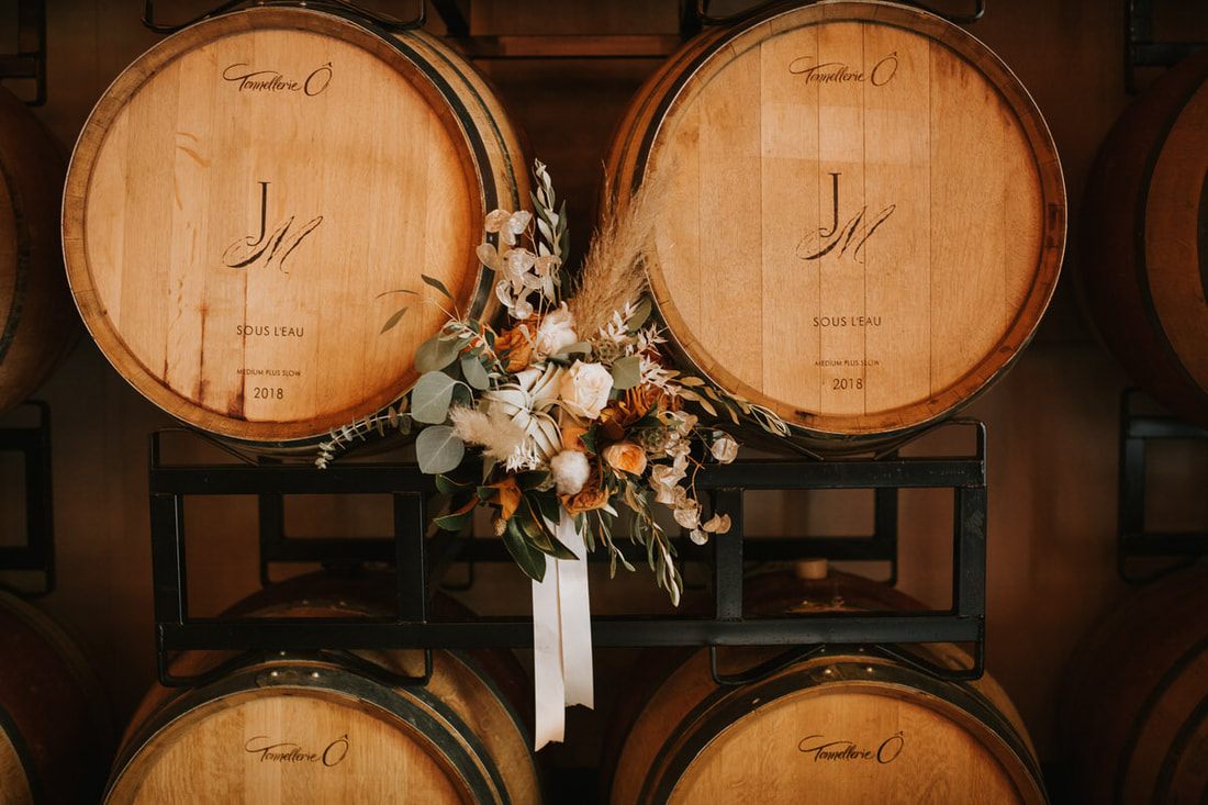 Alex gathered for portraits surrounded by dark, moody florals