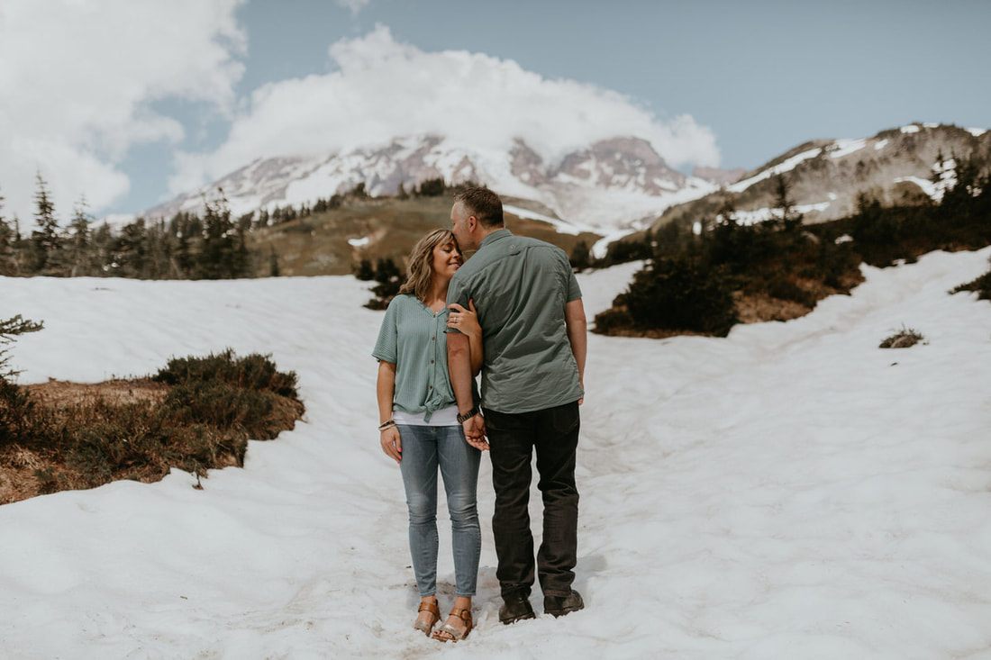Jena and Corey's engagement portrait with Mt. Rainier in the background
