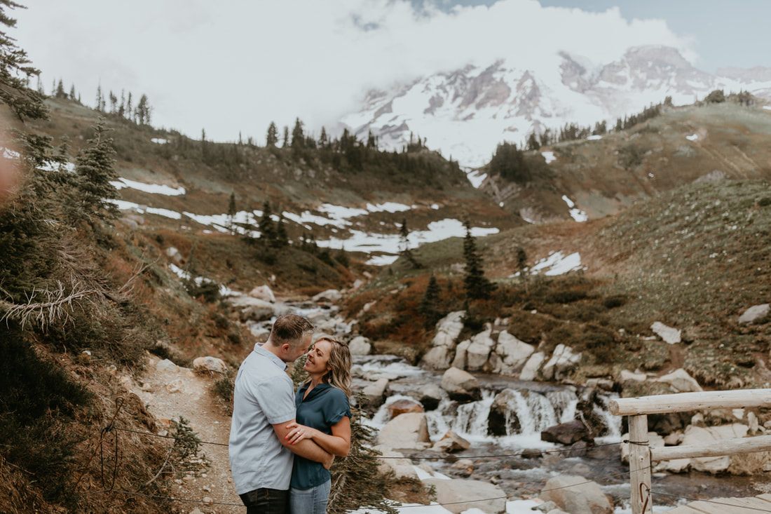 Couple embracing with the Mt. Rainier summit in view