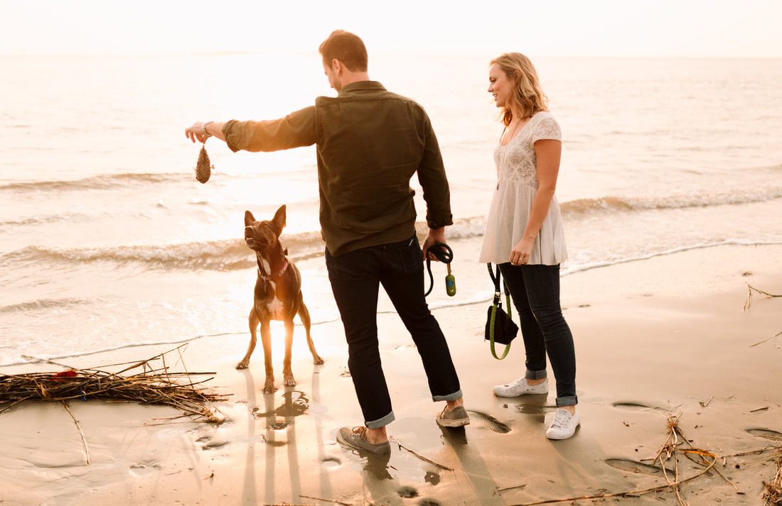 Madison and Ashley laughing together on Sullivan's Island during their engagement session