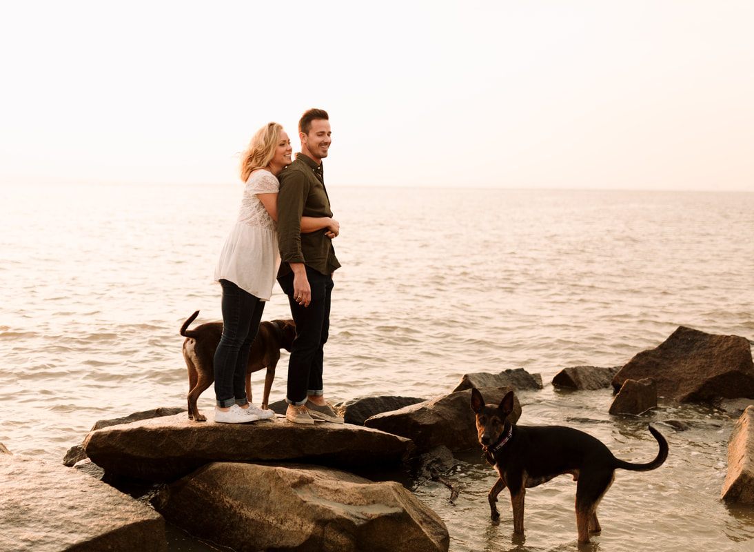 Close-up of the couple smiling together in the Charleston Harbor breeze