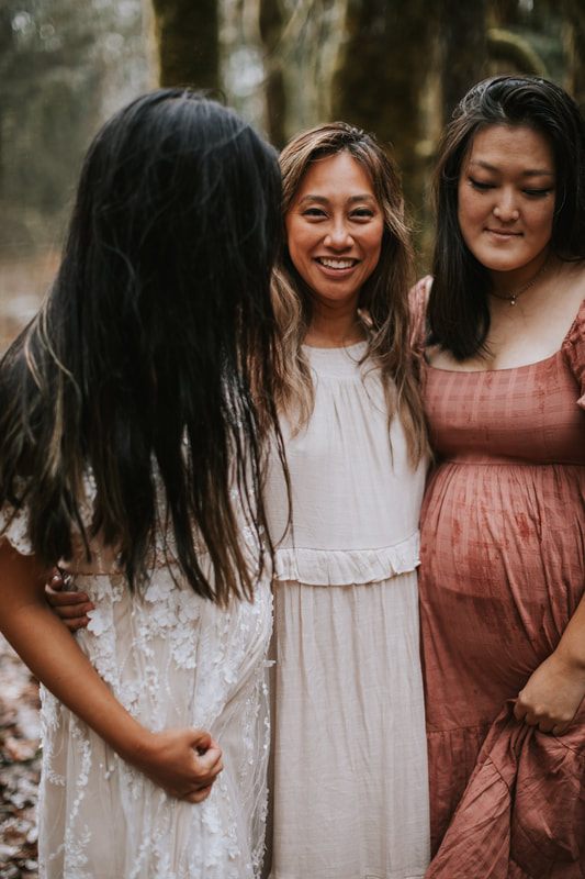 Portrait of a mother-to-be against the a-frame cabin backdrop