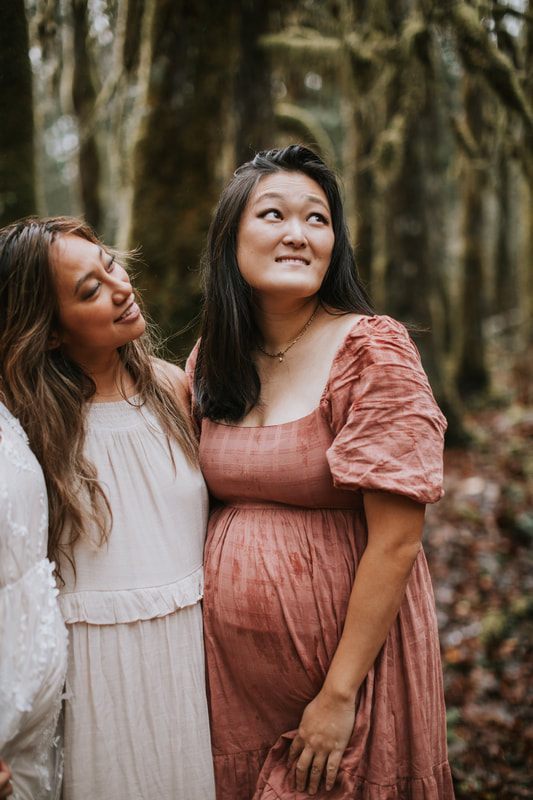 Group portrait of three best friends during their maternity session in the rain