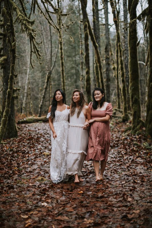 Three best friends walking together in the rain near Index, WA