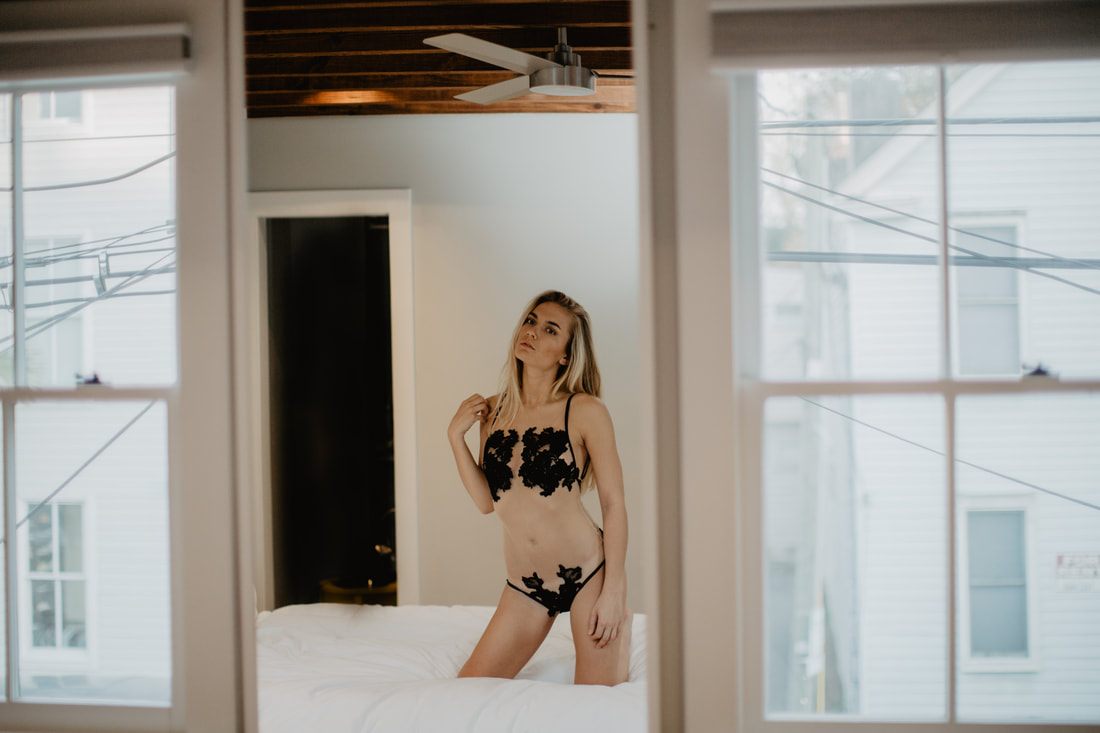 Styled commercial shot of an SJ Lingerie piece with soft, editorial lighting.