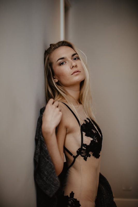 Model posed for the SJ Lingerie brand campaign in a designer lingerie set.