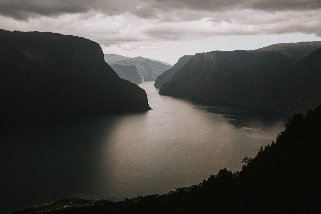 Misty fjord and mountain landscape along the trail to Trolltunga, Norway