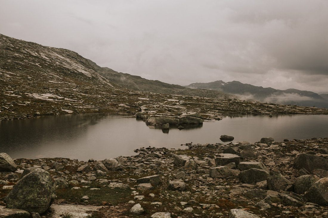 Golden light breaking through clouds over the Trolltunga overlook (another frame from the trip)