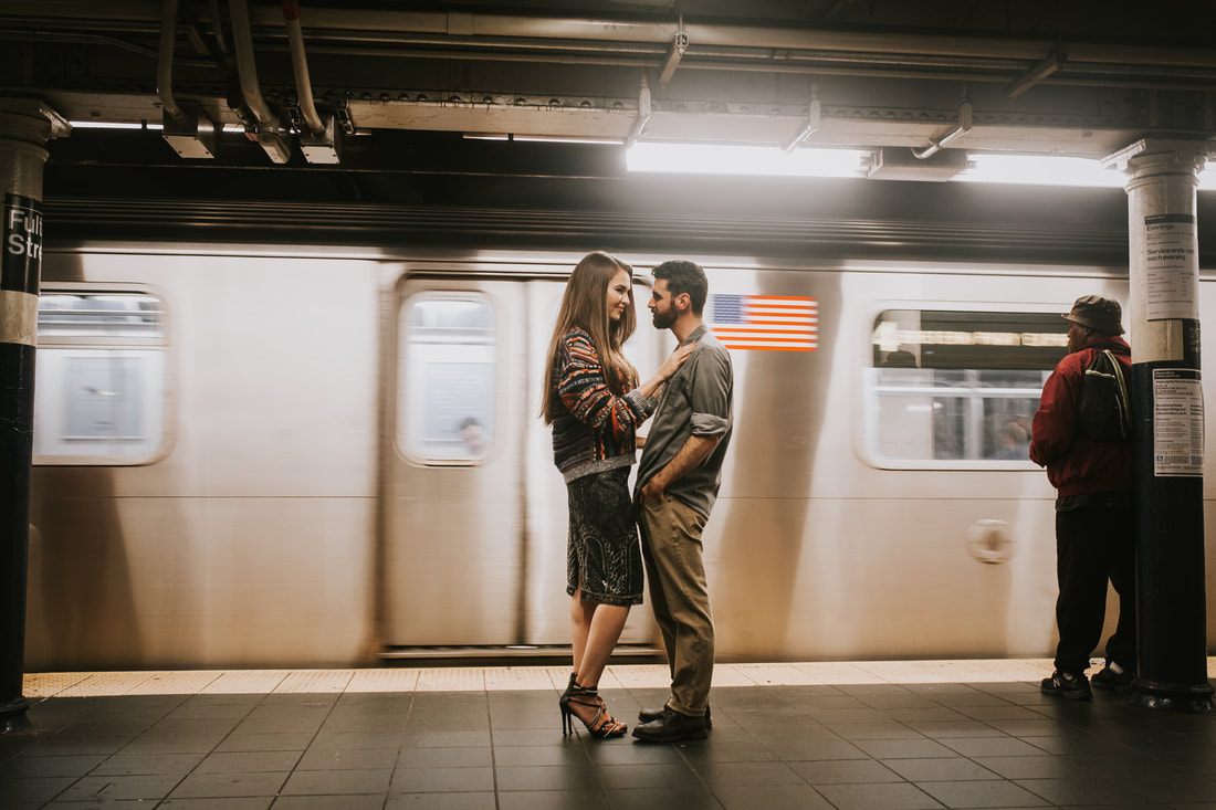 Engaged couple walking hand in hand through New York City
