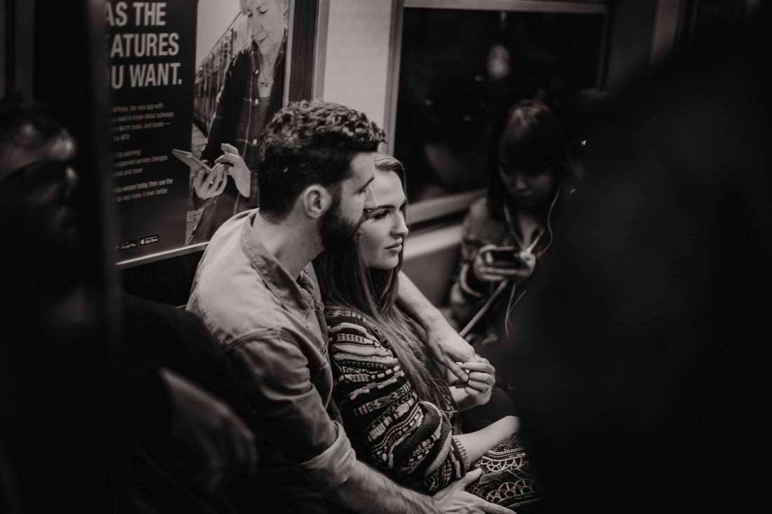 Close-up of the couple's hands and engagement ring in New York City