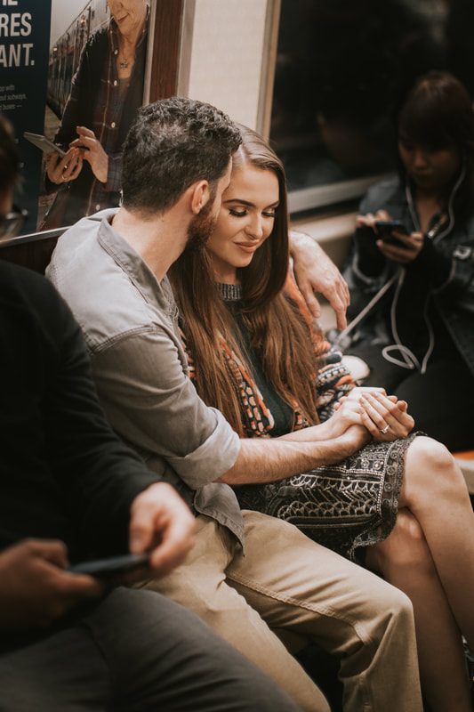 Couple walking together down a New York City avenue