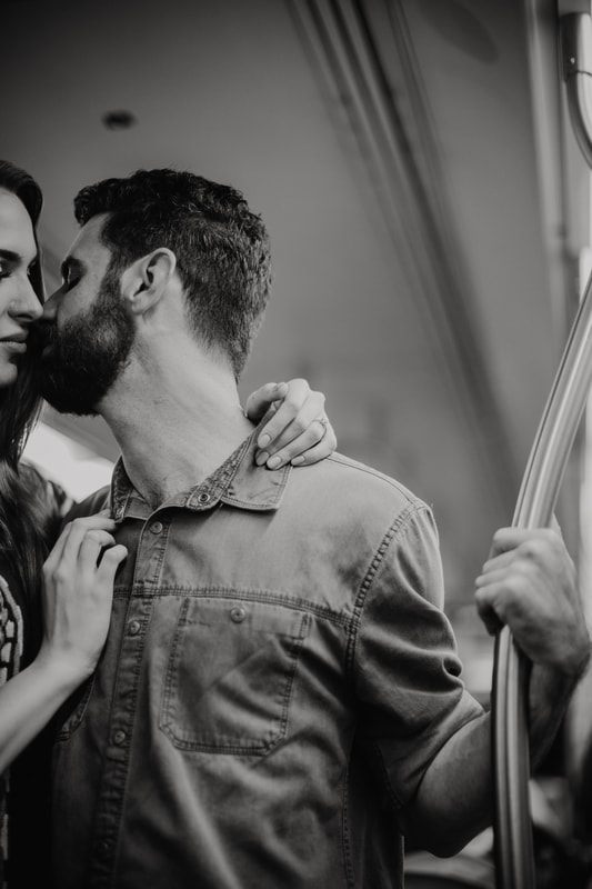 Couple laughing candidly on a New York City street