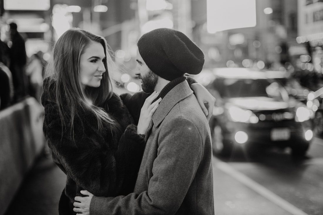Couple's final portrait together on a New York City street at night