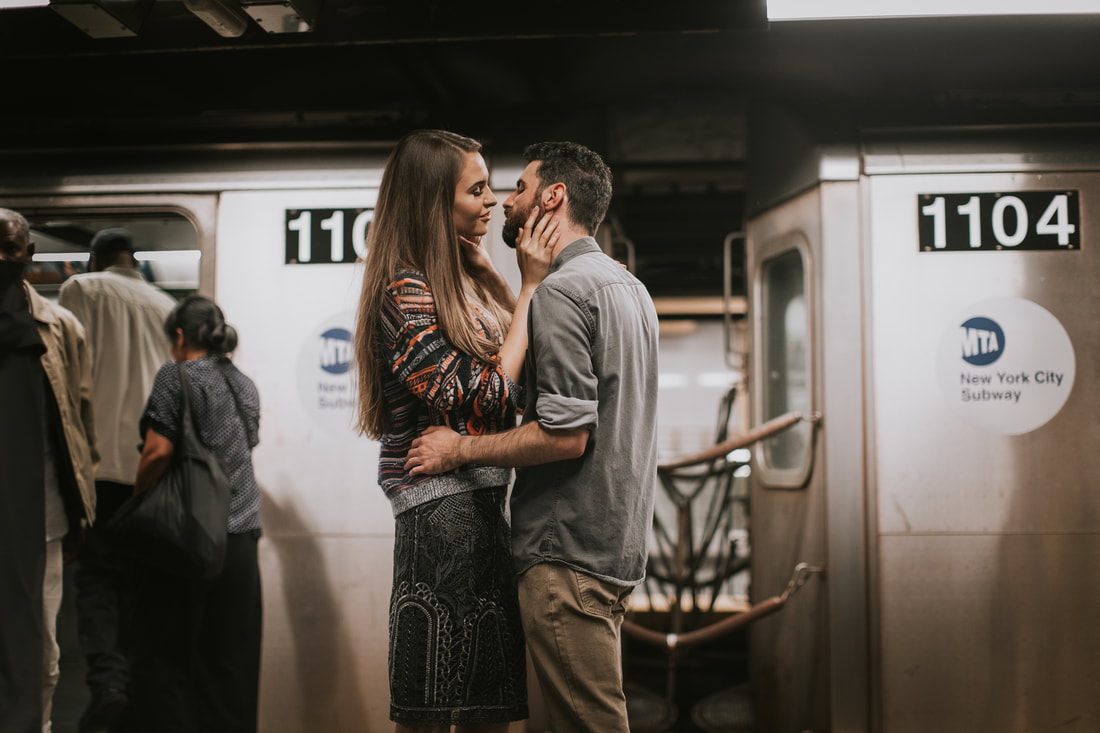 Couple riding the New York City subway together