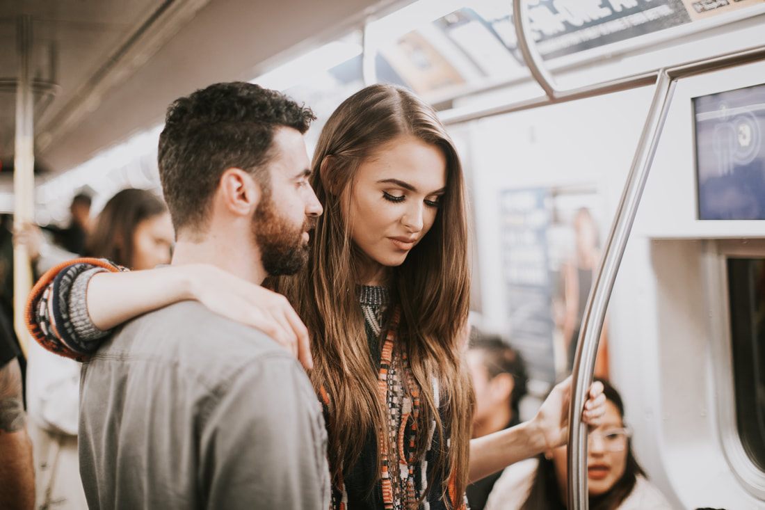 Couple waiting on a New York City subway platform
