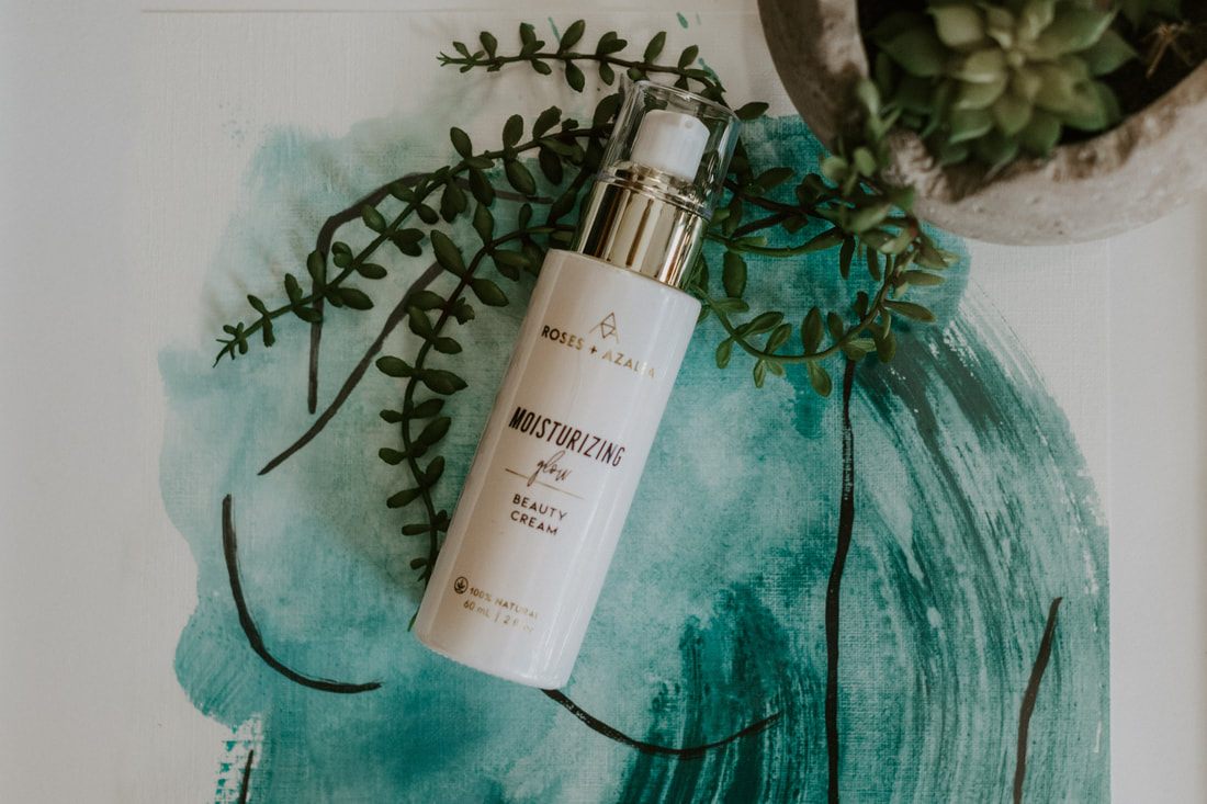 Organic skincare bottle photographed against a neutral backdrop with soft shadow.