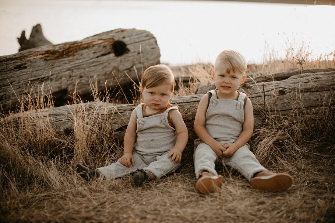 Kids exploring the sand during a golden hour family photo session