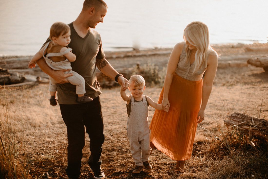 Candid family moment captured during golden hour on the Washington coast