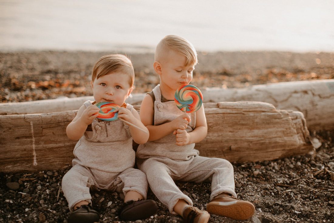 Close-up of two young brothers smiling on the Washington coastline