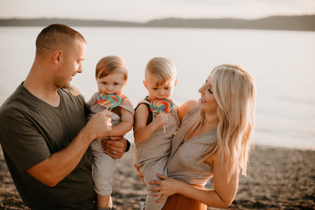Family portrait with soft evening light on the beach in Seattle