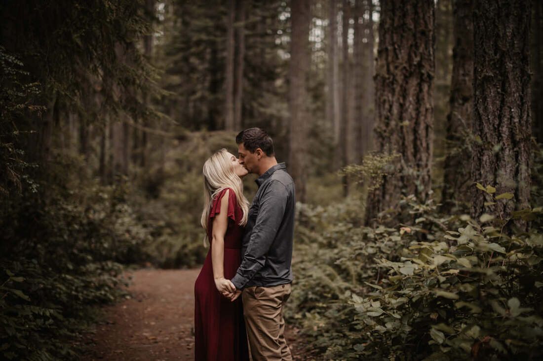 The couple walking along the sandy beach on Bainbridge Island