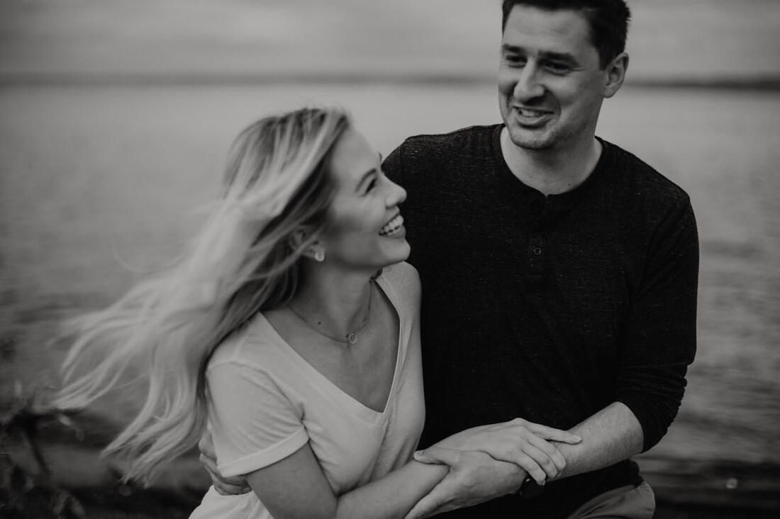 Portrait of the couple among ferns and moss-covered trees