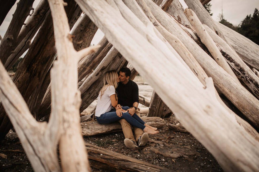 The couple embracing again in the lush PNW forest