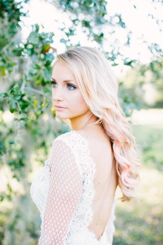 Bride in a boho-glam Modern Trousseau gown posing for a bridal fashion editorial