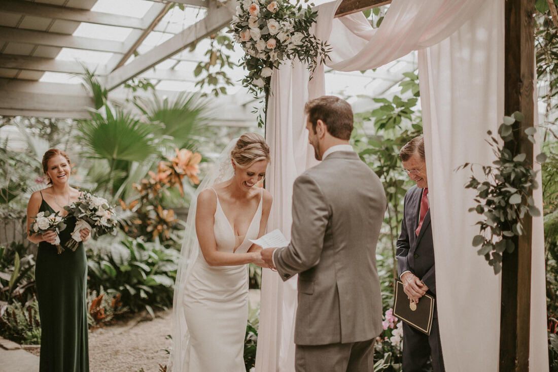 Lindsey and John embracing during their first look at the Magnolia Plantation