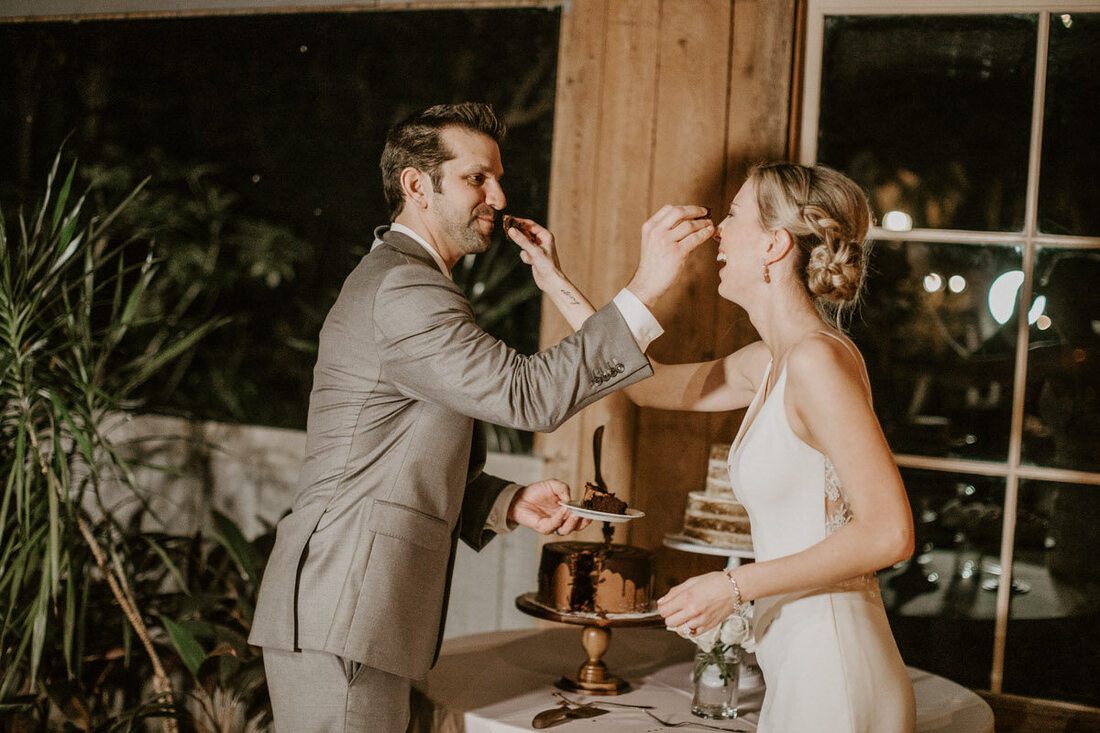 Lindsey and John exchanging vows surrounded by close family and friends