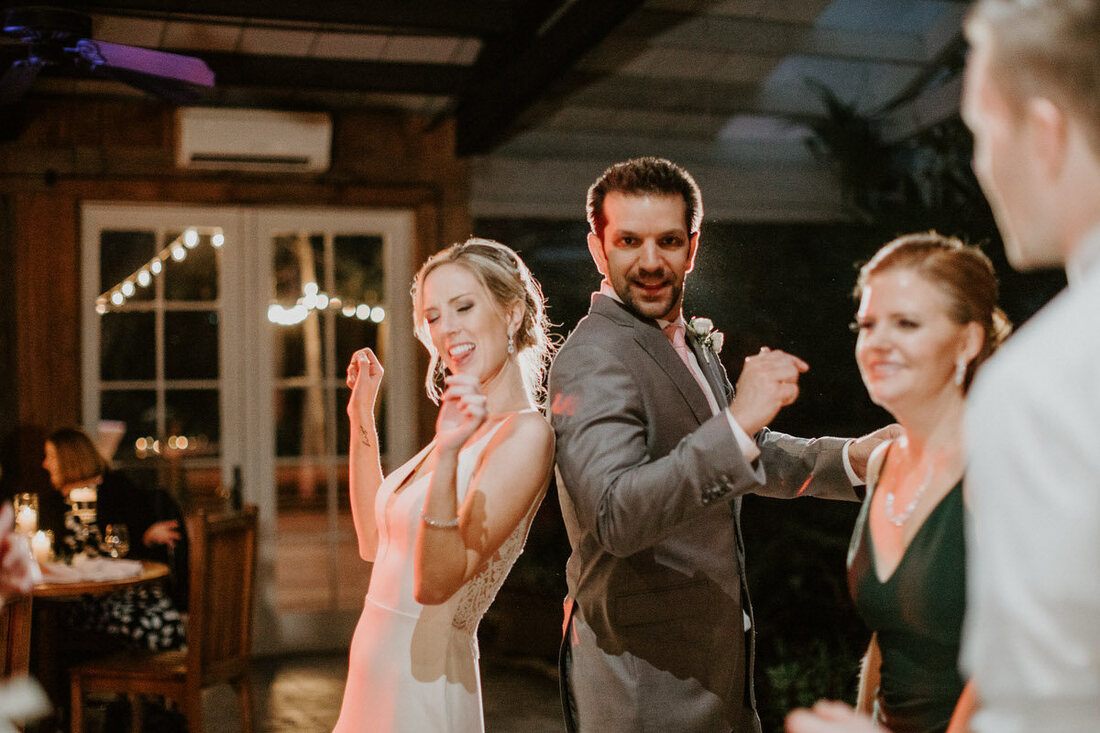 Lindsey and John exchanging rings during their Charleston elopement ceremony