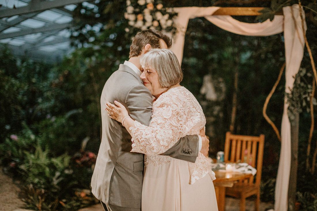 Lindsey and John sharing their first kiss as a married couple
