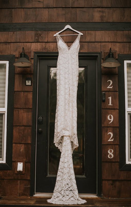Bride looking out the cabin window during her getting-ready session