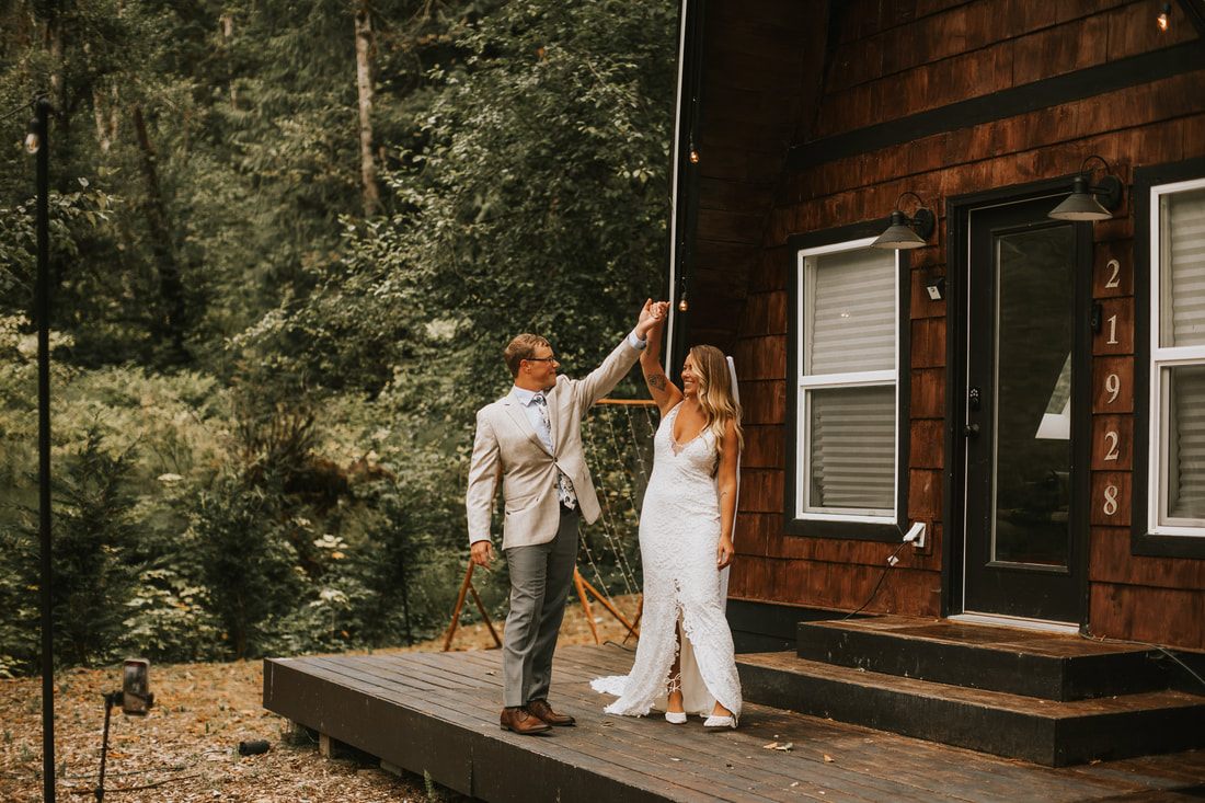 Close-up of the couple exchanging vows by the Skykomish River