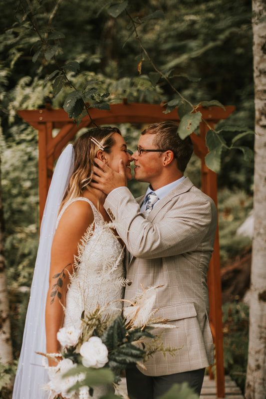 Ring exchange moment during the riverside ceremony