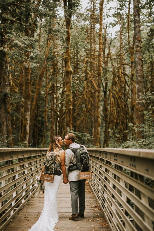 Wide landscape portrait of the couple against the Cascade Mountains