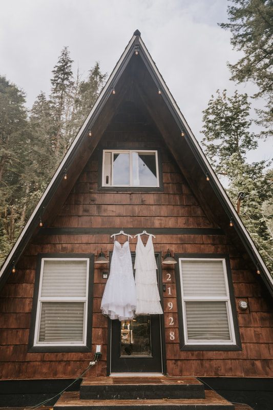 A bride portrait in the misty Washington forest surrounding the cabin
