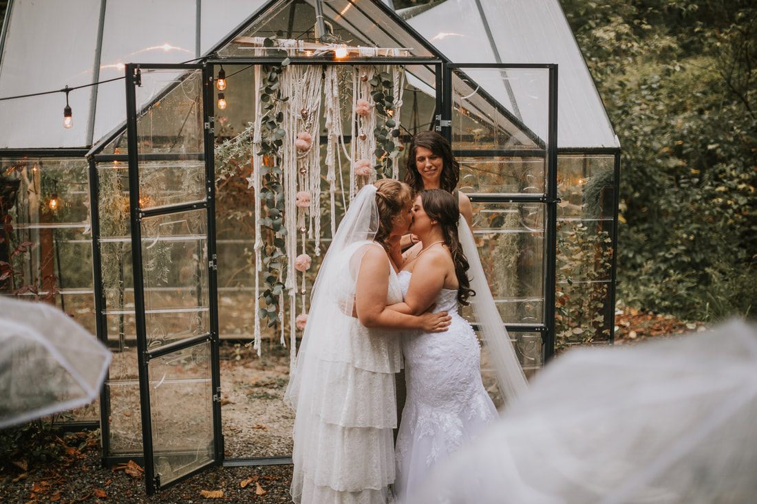 A bride portrait in the misty Washington forest surrounding the cabin, later in the celebration