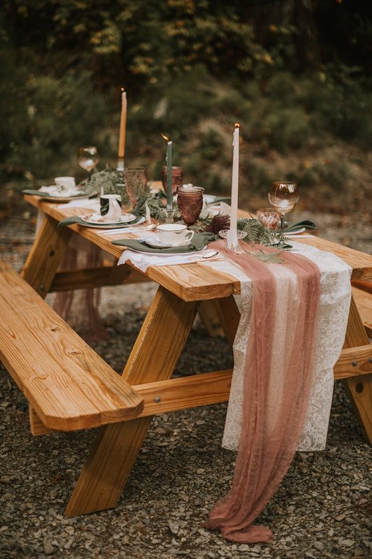 Vintage teacups and saucers set on the tea party wedding tablescape