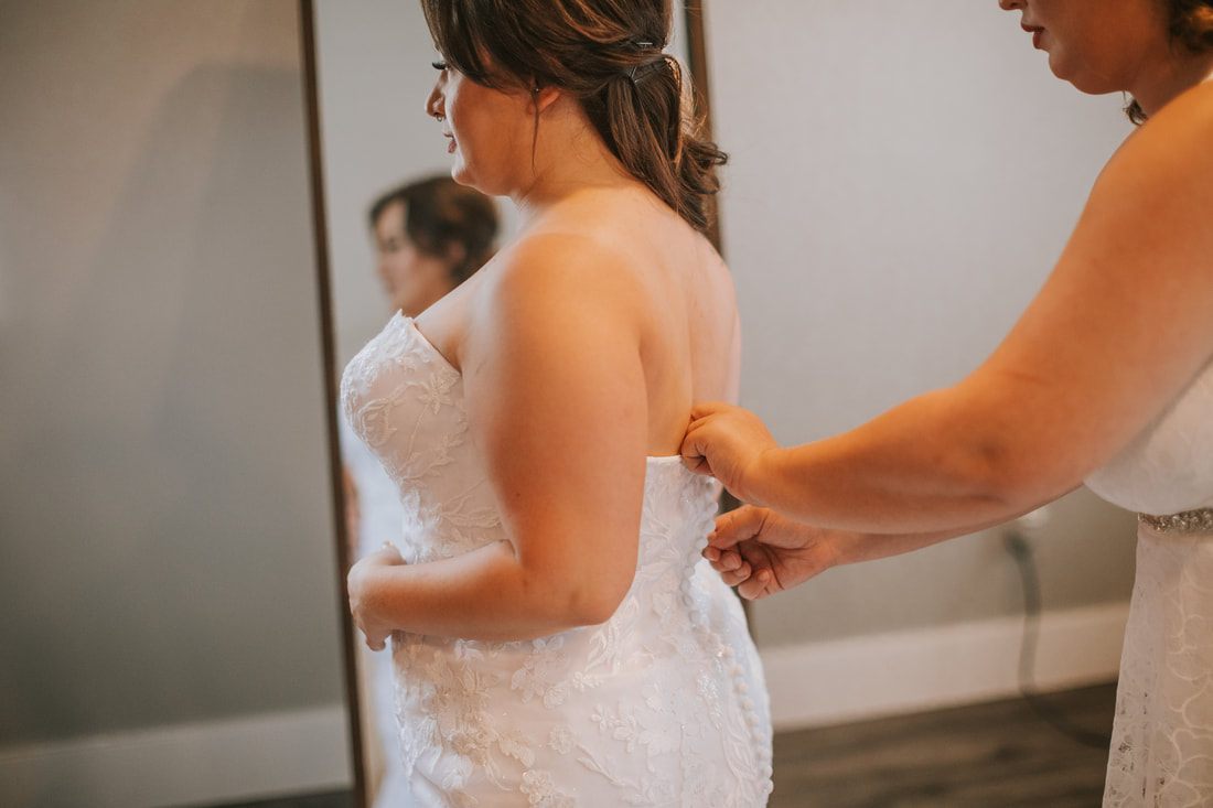 A teacup wedding favor tied with ribbon for guests to take home, captured from another angle