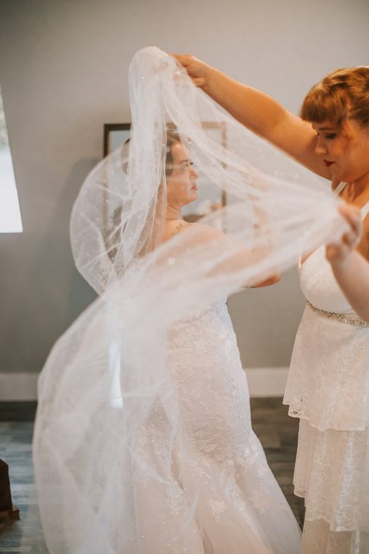 The newlyweds dancing together during the indoor reception, captured from another angle